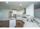 Bright, open kitchen with granite countertops, stainless appliances, and ample cabinet space at 9710 Table Mountain Ln, Ladson, SC 29456