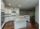 Modern kitchen featuring white cabinets, granite countertops, stainless steel appliances, and a center island at 9710 Table Mountain Ln, Ladson, SC 29456