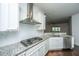 Stylish kitchen with stainless steel appliances, white subway tile backsplash, and granite countertops at 9710 Table Mountain Ln, Ladson, SC 29456