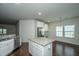 Well-lit kitchen boasts granite countertops, stainless steel appliances, and a functional island at 9710 Table Mountain Ln, Ladson, SC 29456