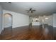 Large, open living room boasts hardwood floors and is illuminated by ample natural light at 9710 Table Mountain Ln, Ladson, SC 29456
