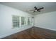 Bright living room with hardwood floors, a ceiling fan, and lots of natural light at 9710 Table Mountain Ln, Ladson, SC 29456