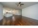 Open concept living room with hardwood floors flows into the kitchen area at 9710 Table Mountain Ln, Ladson, SC 29456