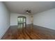 Spacious living room with hardwood floors, ceiling fan, and ample natural light at 9710 Table Mountain Ln, Ladson, SC 29456