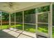Inviting screened porch with a ceiling fan and peaceful views at 9710 Table Mountain Ln, Ladson, SC 29456