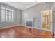 Bedroom with beautiful hardwood floors, plantation shutters and a classic fireplace at 1 King St # 209 & 210, Charleston, SC 29401