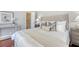 Elegant bedroom boasting a plush bed with decorative pillows and a convenient walk-in closet at 1 King St # 209 & 210, Charleston, SC 29401