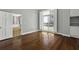 Bedroom featuring hardwood floors, natural light, built in storage and patio access at 1 King St # 209 & 210, Charleston, SC 29401