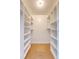 Walk-in closet providing ample storage space with built-in shelving at 1 King St # 209 & 210, Charleston, SC 29401