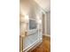 Hallway featuring a glass-top console table with decorative lamps and a scenic painting at 1 King St # 209 & 210, Charleston, SC 29401