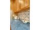 Kitchen counter featuring blue countertops and decorative backsplash at 1 King St # 209 & 210, Charleston, SC 29401