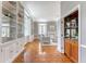 Inviting living room with wet bar, fireplace, built-in shelves, and hardwood floors at 1 King St # 209 & 210, Charleston, SC 29401