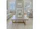 Elegant living room featuring stylish decor, fireplace, and great natural light at 1 King St # 209 & 210, Charleston, SC 29401