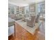 Bright living room with built-in shelving, fireplace, and access to outdoor space at 1 King St # 209 & 210, Charleston, SC 29401