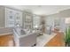 Bright living room with hardwood floors, a fireplace, and an open floor plan at 1 King St # 209 & 210, Charleston, SC 29401