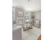 Inviting living room with neutral decor, a fireplace, and expansive windows at 1 King St # 209 & 210, Charleston, SC 29401