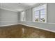 Living room features hardwood floors, plantation shutters, and crown molding at 1 King St # 209 & 210, Charleston, SC 29401