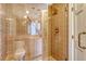 Elegant walk-in shower with built-in bench and sleek bronze fixtures at 1 King St # 209 & 210, Charleston, SC 29401