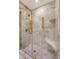 Luxurious marble shower with glass door and sleek gold fixtures at 1 King St # 209 & 210, Charleston, SC 29401