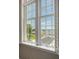 Bright window offers beautiful views of the waterfront and nearby park with tropical palm trees at 1 King St # 209 & 210, Charleston, SC 29401