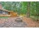 Backyard featuring a patio, hot tub, fire pit, and mature landscaping at 100 Dacs Ln, Summerville, SC 29483