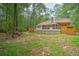 Exterior backyard view with a patio, above-ground pool, and mature trees at 100 Dacs Ln, Summerville, SC 29483