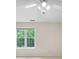 Bedroom with ceiling fan and window overlooking lush greenery at 100 Dacs Ln, Summerville, SC 29483
