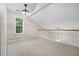 Upstairs bonus room features neutral carpet and a modern ceiling fan at 100 Dacs Ln, Summerville, SC 29483