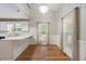 Bright dining area with wood floors, large windows, and access to the kitchen at 100 Dacs Ln, Summerville, SC 29483