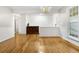 Hardwood floors in an open dining area with antique sideboard and chandelier at 100 Dacs Ln, Summerville, SC 29483