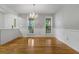 Bright dining area featuring hardwood floors and views of the front yard at 100 Dacs Ln, Summerville, SC 29483