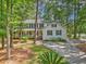 Charming two-story home with a welcoming front porch and lush landscaping at 100 Dacs Ln, Summerville, SC 29483