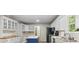 Functional kitchen with white cabinets, black appliances, and a practical layout at 100 Dacs Ln, Summerville, SC 29483