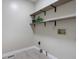 Functional laundry room with shelving for organized storage at 100 Dacs Ln, Summerville, SC 29483