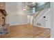 Bright living room featuring vaulted ceiling, brick fireplace, and staircase at 100 Dacs Ln, Summerville, SC 29483
