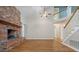 Spacious living room with brick fireplace and views of the staircase at 100 Dacs Ln, Summerville, SC 29483