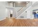 Open living area with staircase, hardwood floors, and natural light at 100 Dacs Ln, Summerville, SC 29483