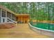 Above-ground pool and deck surrounded by lush trees at 100 Dacs Ln, Summerville, SC 29483