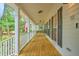 Inviting front porch with a swing offering a relaxing outdoor space at 100 Dacs Ln, Summerville, SC 29483