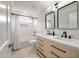 Bathroom featuring double vanity with modern faucets, tub with shower and rectangular mirrors at 1000 Retreat Ave, Moncks Corner, SC 29461
