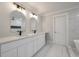 Stylish bathroom with double vanity, arched mirrors, and sleek fixtures at 1000 Retreat Ave, Moncks Corner, SC 29461
