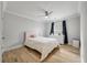 Cozy bedroom featuring hardwood floors, and a white-painted ceiling fan at 1000 Retreat Ave, Moncks Corner, SC 29461