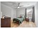 Cozy bedroom with hardwood floors, ceiling fan, and natural light from window at 1000 Retreat Ave, Moncks Corner, SC 29461