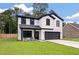Charming two-story home with modern farmhouse design, white siding, black trim, and inviting front porch at 1000 Retreat Ave, Moncks Corner, SC 29461