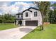 Charming two-story home with modern farmhouse design, white siding, black trim, and inviting front porch at 1000 Retreat Ave, Moncks Corner, SC 29461