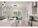 Eat-in kitchen features quartz counters, subway tile, stainless appliances and natural light streaming through the backyard sliding door at 1000 Retreat Ave, Moncks Corner, SC 29461