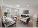 Cozy living room with modern sofas, rug, and a media center at 1000 Retreat Ave, Moncks Corner, SC 29461