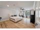 Bright main bedroom with hardwood floors, a king-size bed, and large windows at 1000 Retreat Ave, Moncks Corner, SC 29461