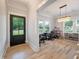 Bright and spacious office with a large window, modern lighting fixture, and hardwood floors at 1000 Retreat Ave, Moncks Corner, SC 29461