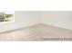 Large bedroom with neutral carpet, light walls and a view of the neighborhood at 1009 Marsh Harrier Dr # Cc3-2-2P, Ravenel, SC 29470
